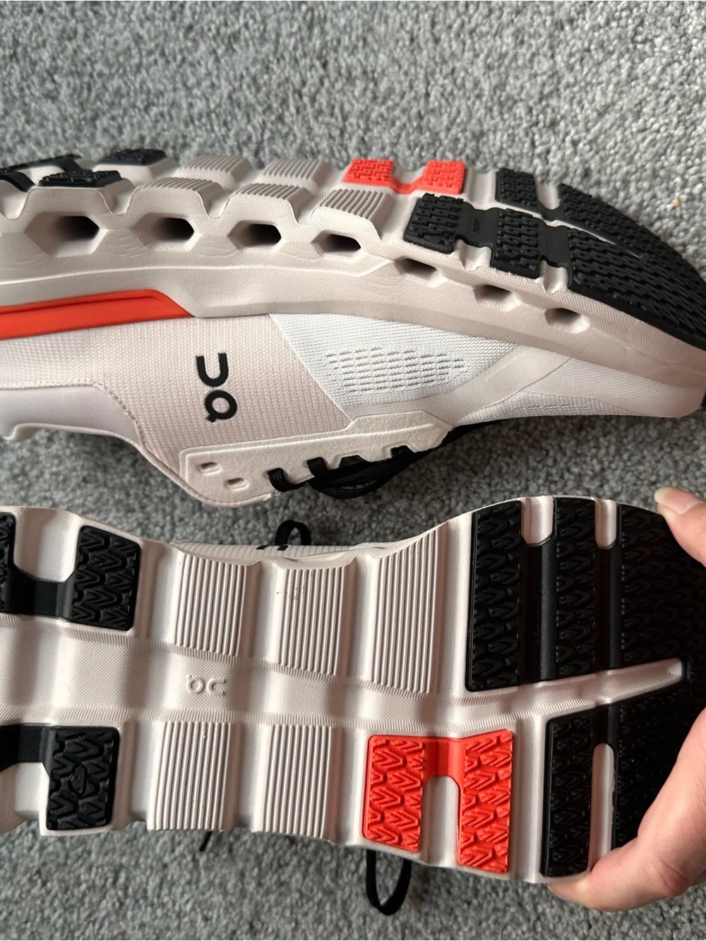 On Running Women’s Running Sneakers in Light Pink with Orange Accents